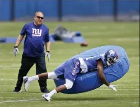  ?? SETH WENIG — THE ASSOCIATED PRESS ?? New York Giants’ Dominique Rodgers-Cromartie, right, participat­es in a practice Wednesday in East Rutherford, N.J.,