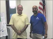  ?? BILL DEBUS — THE NEWS-HERALD ?? Elias Coss, right, poses for a picture after being appointed on Aug. 13 as the newest member of Perry Village Council. Joining him for the photo is village Mayor James Gessic.