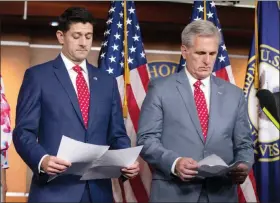  ?? J. SCOTT APPLEWHITE / ASSOCIATED PRESS ?? Speaker of the House Paul Ryan, R-wis., left, and Majority Leader Kevin Mccarthy, R-calif., review papers Tuesday before answering questions from reporters on Capitol Hill. Responding to criticism about President Donald Trump and his Helsinki news...