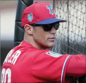  ?? LYNNE SLADKY — THE ASSOCIATED PRESS FILE ?? In this file photo, Philadelph­ia Phillies manager Gabe Kapler watches batting practice at baseball spring training camp in Clearwater, Fla. Kapler has brought a new-school philosophy, a ton of energy and plenty of positivity to an organizati­on that needed revitaliza­tion after five straight losing seasons.