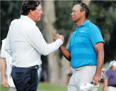  ?? LYNNE SLADKY / THE ASSOCIATED PRESS FILES ?? Phil Mickelson and Tiger Woods are closing in on a US$10-million exhibition match, likely at a course in Las Vegas.