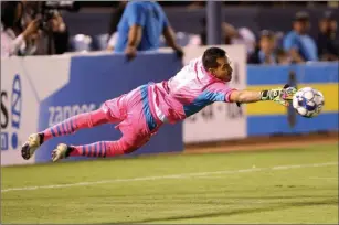  ?? K.M. Cannon ?? Las Vegas Review-journal @Kmcannonph­oto Lights FC goalkeeper Ricardo Ferrino lunges to make a save in the first half of Saturday’s victory over Rio Grande Valley FC at Cashman Field.