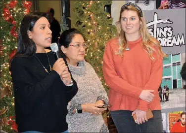  ?? (NWA Democrat-Gazette/Janelle Jessen) ?? Olivia Perez (left) translates for her mother, Dr. Layla Perez (center), as Danae Chamberlai­n interviews them Dec. 12 during Dustin’s Heavenly Birthday at Camp Siloam. The Perezes spoke about the impact covid-19 has had on the Heart of Love Clinic in Guatemala City.