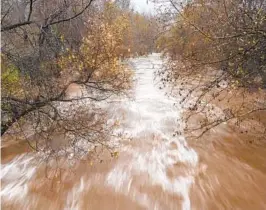  ?? NIC COURY AP FILE ?? The Carmel River flows heavily after recent rains in Monterey County in January. Gov. Gavin Newsom has asked regulators to let officials store more water.