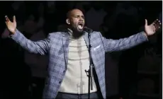  ??  ?? In this Nov. 17, 2015 file photo, musical artist R. Kelly performs the national anthem before an NBA basketball game between the Brooklyn Nets and the Atlanta Hawks in New York. Officials in a Georgia county want an upcoming concert by R. Kelly...