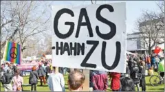 ?? AFP ?? A man participat­ing in a demonstrat­ion against the war in Ukraine holds up a banner reading ‘Close Gas-tap’ in Stuttgart, southern Germany, on March 13.
