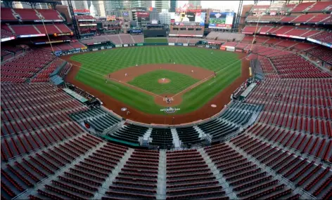  ?? AP Photo/Jeff Roberson, File ?? In this 2020 file photo, empty seats are viewed in Busch Stadium as St. Louis Cardinals starting pitcher Jack Flaherty throws in the first inning baseball game against the Pittsburgh Pirates in St. Louis.