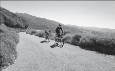  ?? The Associated Press ?? CYCLING TOUR: In this undated photo provided by The Cycling House, two cyclists are shown on Mount Figueroa outside of Solvang, Calif., during a tour run by the Montana based company. The Cycling House runs week long cycling trips out of Solvang in...