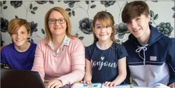  ?? Noreen Kirwan studying at home with her children Ethan, Emily and Tristan. ??