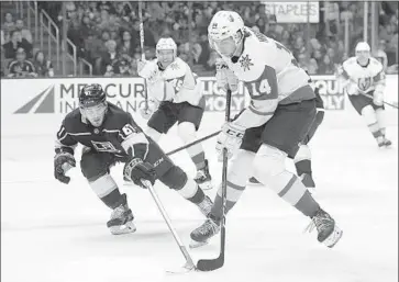  ?? Michael Owen Baker Associated Press ?? DEFENSEMAN SEAN WALKER, challengin­g Vegas defenseman Nicolas Hague during an exhibition game in September, is called up by the Kings from their affiliate in the American Hockey League.