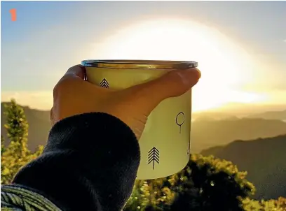  ?? CLARISSA HIRST ?? There’s not much that can beat watching the sun go down with a cup of tea at the Mt Heale DOC hut on Great Barrier Island.