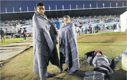  ?? Photo / AP ?? Jerson Suazo and Anabel Pineda rest for the night with their 6-year-old son Fernando in Mexico City.