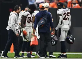  ?? RJ SANGOSTI — THE DENVER POST ?? Broncos running back Javonte Williams is helped off the field after hurting his knee against the Raiders at Allegiant Stadium in Las Vegas.