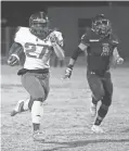  ?? ROB SCHUMACHER/THE REPUBLIC ?? Centennial running back Kavaughn Clark (27) runs for a touchdown against Liberty in Peoria on Nov. 20.