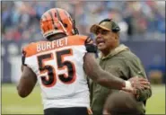  ?? MARK ZALESKI — THE ASSOCIATED PRESS ?? Cincinnati Bengals head coach Marvin Lewis talks with outside linebacker Vontaze Burfict (55) after Burfict was ejected for making contact with an official in the first half of an NFL football game against the Tennessee Titans Sunday in Nashville, Tenn.