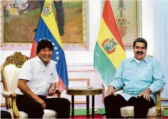  ?? Imprensa Presidenci­al/AVN/Xinhua ?? Evo Morales, da Bolívia (esq.), e Nicolás Maduro, da Venezuela, se reúnem em Caracas