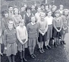  ??  ?? Senior pupils of Stuartfiel­d School line up for the photograph­er. This is a school with a splendid academic tradition