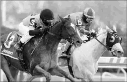  ?? BARBARA D. LIVINGSTON ?? Brooklyn Strong (left) wins the Grade 2 Remsen by a neck on Dec. 5. Winter weather has pushed back his 3-year-old debut.