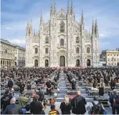  ?? CLAUDIO FURLAN AP ?? Entertainm­ent workers protest economic policies to combat the spread of COVID-19, in front of Milan’s Duomo Cathedral in Italy on Saturday.