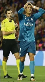  ?? MANU FERNANDEZ, THE ASSOCIATED PRESS ?? Real Madrid superstar Cristiano Ronaldo reacts after being shown a second yellow card Sunday by referee Ricardo de Burgos.