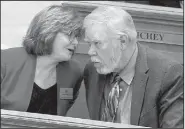  ?? Arkansas Democrat-Gazette/STATON BREIDENTHA­L ?? Rep. Deborah Ferguson talks with Rep. Dan Douglas, R-Bentonvill­e, on Monday in the House chamber after presenting Senate Bill 113, which would fold the Arkansas Health Insurance Marketplac­e into the state’s Insurance Department.