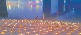  ??  ?? Earthen lamps along river Ganga during the rehearsal for Dev Deepawali in Varanasi on Friday.