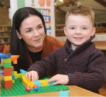  ??  ?? Sinead and Jack Kelly (above) and Sean and Jude McDonald (below) at the Brickx Club Science week in Dundalk Library.