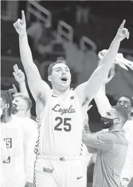  ?? ANDY LYONS / GETTY ?? Cameron Krutwig and Loyola teammates react after a win over Georgia Tech on Friday in the first round of the NCAA Tournament.