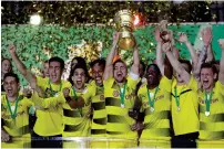  ?? AP ?? Dortmund’s Marcel Schmelzer raises the cup after Dortmund won the German Cup final against Eintracht on Saturday. —