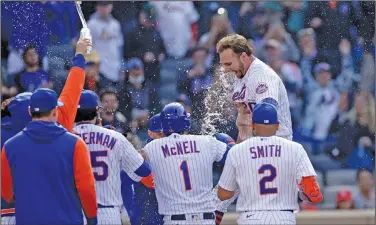  ?? Associated Press ?? Celebratin­g: New York Mets' Pete Alonso celebrates his walk-off two-run home run with teammates during the 10th inning of a baseball game against the St. Louis Cardinals on Thursday in New York. The Mets won 7-6 in 10 innings.