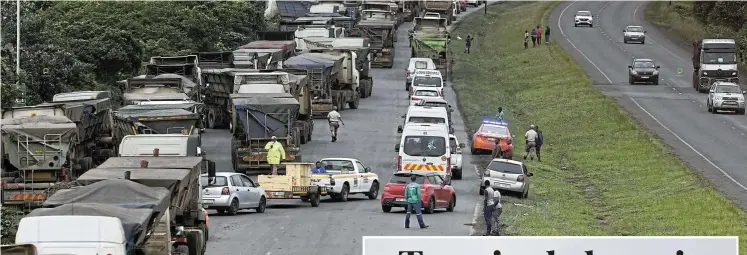  ?? Pictures: Sandile Ndlovu ?? Congestion on the John Ross Highway and N2 caused by hundreds of coal trucks waiting to offload at the port in Richards Bay has led to the municipali­ty having to fork out its entire R4m overtime budget to pay traffic officers in the first four months of its financial year.