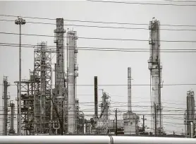  ?? Mark Mulligan / Staff file photo ?? Chevron’s Pasadena refinery is shown. Oil and gas companies are bracing for lower oil prices for longer as coronaviru­s cases continue to climb nationally.