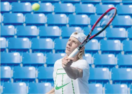  ?? PHOTOS: PAUL CHIASSON/THE CANADIAN PRESS ?? Denis Shapovalov returns a ball while training in Montreal on Thursday ahead of the U.S. Open.