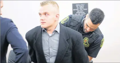  ?? TARA BRADBURY/THE TELEGRAM ?? Kyle Morgan looks at his lawyer, Mike King, as he is taken into custody to begin the sentence given to him Tuesday by Judge Colin Flynn. Morgan pleaded guilty to being an accessory after the fact to manslaught­er in connection with the stabbing death of...