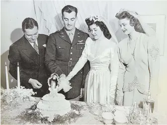  ?? COURTESY PHOTO ?? THE START: Bettye DeYoung, right center, is shown cutting her wedding cake with husband Art DeYoung in 1945 while wearing the wedding dress that would later be worn by her daughter-in-law Ofelia DeYoung and granddaugh­ter Jennifer Kramer at their...