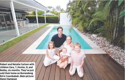  ?? Main picture: Glenn Hampson ?? Robert and Natalie Carlson with children Zara, 7, Hunter, 8, and Bobby, six months. They’ve just sold their home on Burrendong Rd in Coombabah.