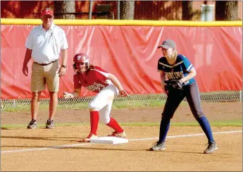  ?? MARK HUMPHREY ENTERPRISE-LEADER ?? Farmington coach Randy Osnes, shown coaching third base while Carley Antwine poises herself to race home against Harrison in an 8-1 victory on April 4, achieved a milestone with his 500th career win April 1 over Conway. Osnes has been head coach at Farmington since 1996. He has guided the Lady Cardinals to state championsh­ips in 2000, 2005 and 2011, three state runner-up finishes in 2001, 2002 and 2003, plus 19 conference championsh­ips. Osnes has been selected as head coach for the West All-Stars for 2017.