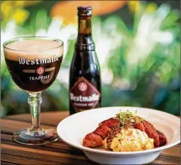  ?? PHOTOS BY MIA YAKEL ?? Brick Store Pub’s Sausage and Root Vegetable Mash with pickled mustard seeds paired with Westmalle Trappist Ale.