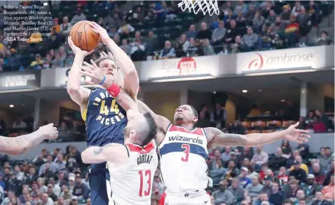  ?? — USA Today Sports ?? Indiana Pacers’ Bojan Bogdanovic (44) takes a shot against Washington Wizards’ Bradley Beal (3) and Marcin Gortat (13) at Bankers Life Fieldhouse.