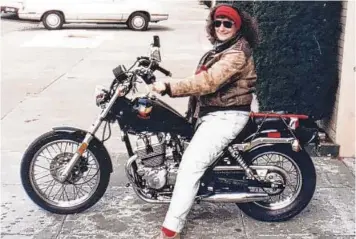  ?? KENNETH HARMON VIA NYT ?? Barbara Joans on her first motorcycle in the 1990s. Joans, author of “Bike Lust: Harleys, Women, and American Society,” died March 6.