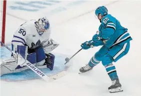  ?? THE ASSOCIATED PRESS FILE PHOTO ?? Sharks’ Erik Karlsson scores against Toronto goalie Erik Kallgren in overtime in October. Karlsson had nine goals in 12 games heading into play Thursday.