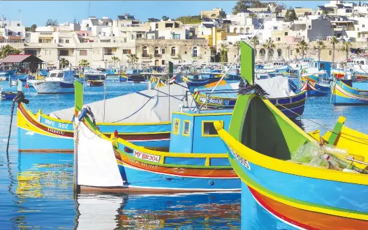  ?? GRETCHEN STRAUCH ?? According to local tradition, the colours of these Maltese fishing boats that dot the coastline represent a fisherman’s home village.