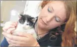 ?? FM2768625 ?? Amy Sabin at the RSPCA centre with one of the kittens