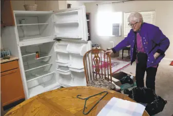  ?? Scott Strazzante / The Chronicle ?? Journey’s End resident Theresa Udall, 83, visits her red-tagged residence in the burned-out mobile-home park. She’s now living in an apartment with rent eating up most of her income.