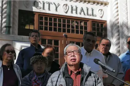  ?? Photos by Jerry Lara / Staff photograph­er ?? Alex Lim speaks during a news conference Tuesday announcing his family’s lawsuit against the city over the fate of the Whitt Printing Co. building, which the family owns. The suit is the latest move in an ongoing dispute over the building’s preservati­on.