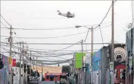  ?? Joe Raedle Getty Images ?? PESTICIDE is sprayed to target mosquitoes that may carry the Zika virus in the Wynwood area of Miami last month. There is no vaccine or treatment for Zika.