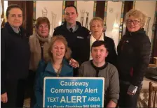  ??  ?? Gardaí and Causeway Community Alert scheme members with the new signs going up in the village to help fight crime.