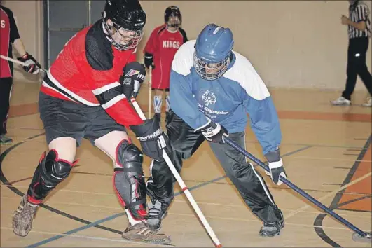  ?? - John DeCoste, www.kingscount­ynews.ca ?? Kings, left, and Halifax athletes battle during floor hockey action at the Special Olympics Nova Scotia provincial Winter Games Feb. 20 at Camp Aldershot.