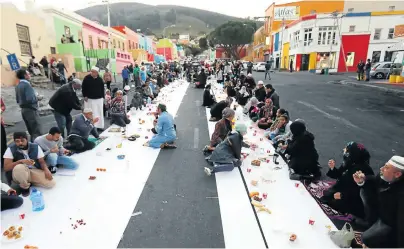  ??  ?? Residents of the Bo-Kaap celebrate the ‘iftar’ (breaking of the fast) at a street party in Wale Street in May.