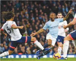  ?? (AFP) ?? Manchester City’s Raheem Sterling (right) has recently been rewarded with a new five-year contract, worth a reported £300,000 a week, by the Premier League leaders.